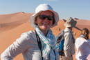 Helen climbs a sand dune